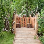 Wood pathway to a stump seating space